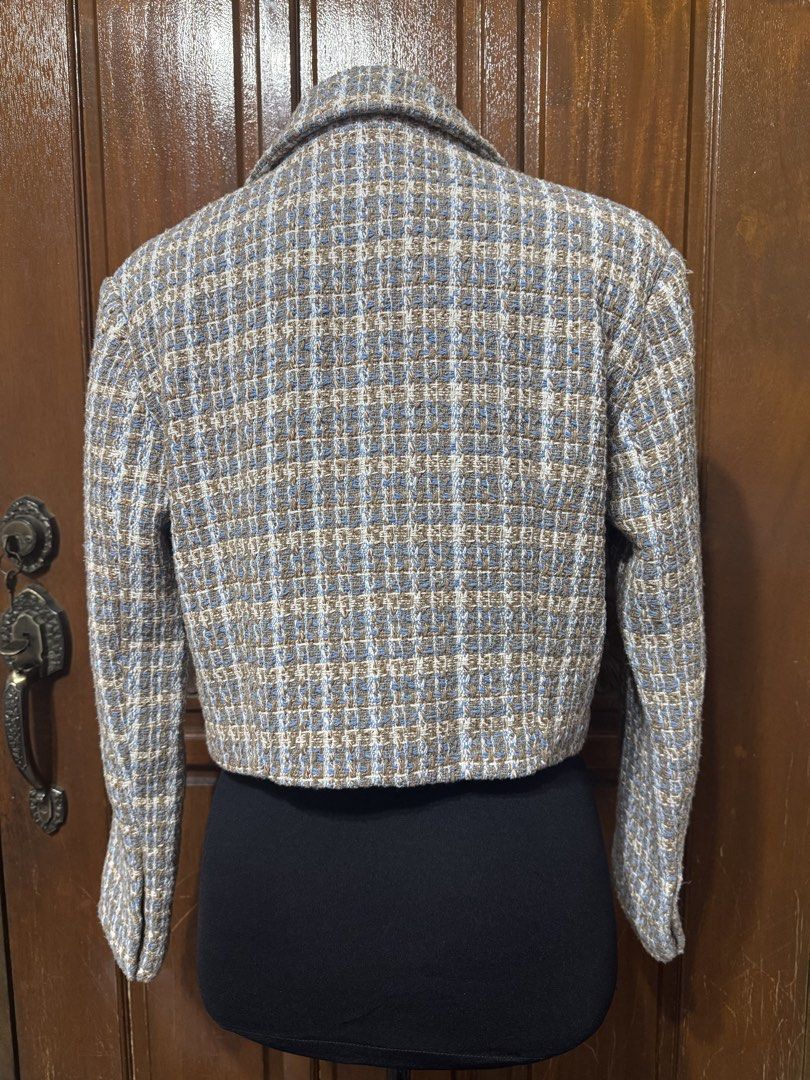 SHEIN Cropped Tweed Blazer Jacket (Category: Coats, Jackets and Outerwear) located in Manila. Submitted by prelovedshopmnl (Listing ID 1463575276, Image 2). Description: - Cute cropped tweed jacket from SHEIN - Classic plaid pattern in brown, blue, and white with lapel collar - Ideal for layering over tops or dresses - Creates a chic and stylish look.