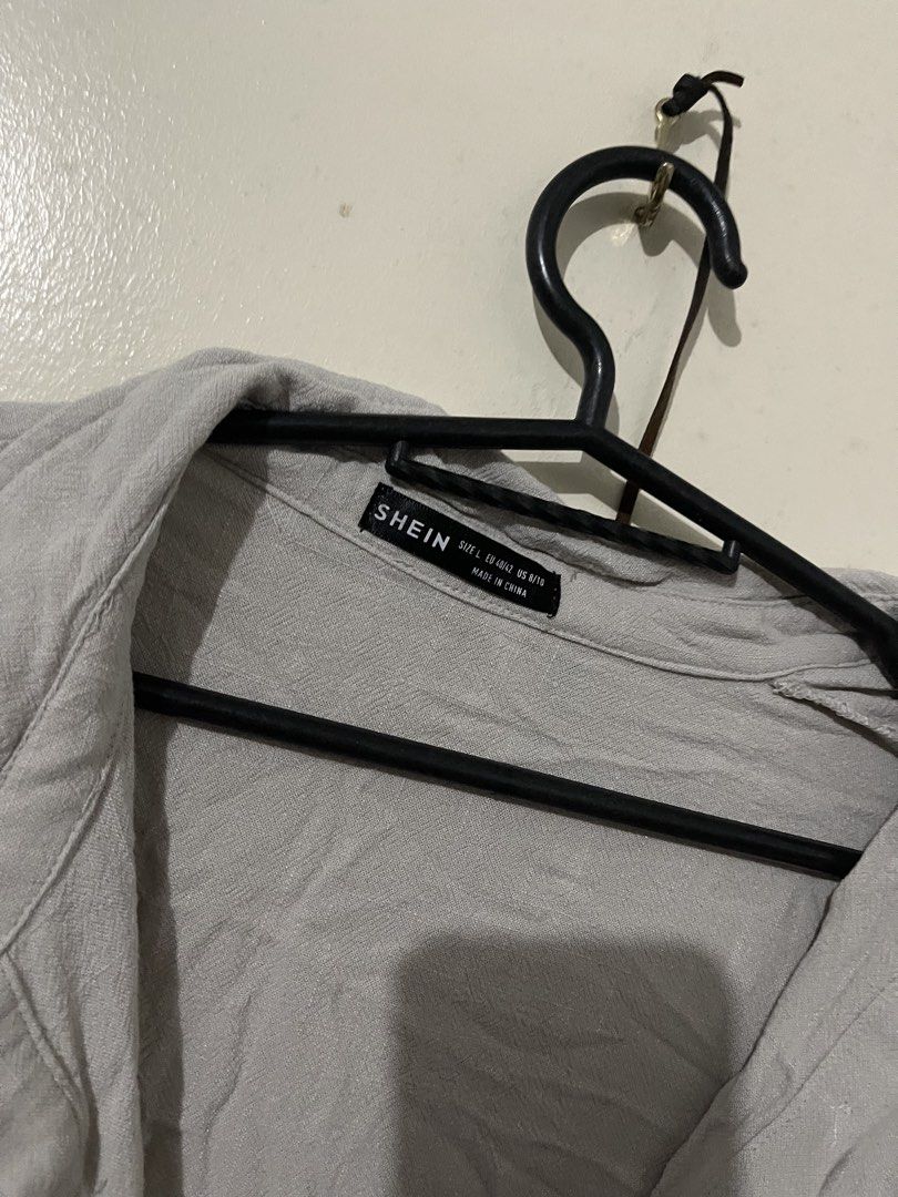 SHEIN Grey Cut-out Button-Down Shirt Dress (Category: Dresses) located in Manila. Submitted by nhatzgold (Listing ID 1463686635, Image 3). Description: - SHEIN Grey Shirt Dress - Size: S to M (fits both) - Features: Waist cut-out detail, button-down front, side pockets - Price: P150.00.