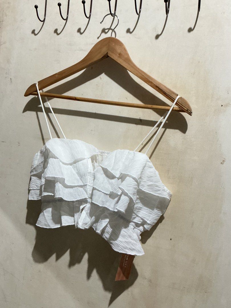 SHEIN WHITE RUFFLE CROP TOP (Category: Sleeveless) located in Dagupan City. Submitted by trendies_collection (Listing ID 1463616649, Image 2). Description: Brand new with pouch and hang tag Large to semi Xl No issue.