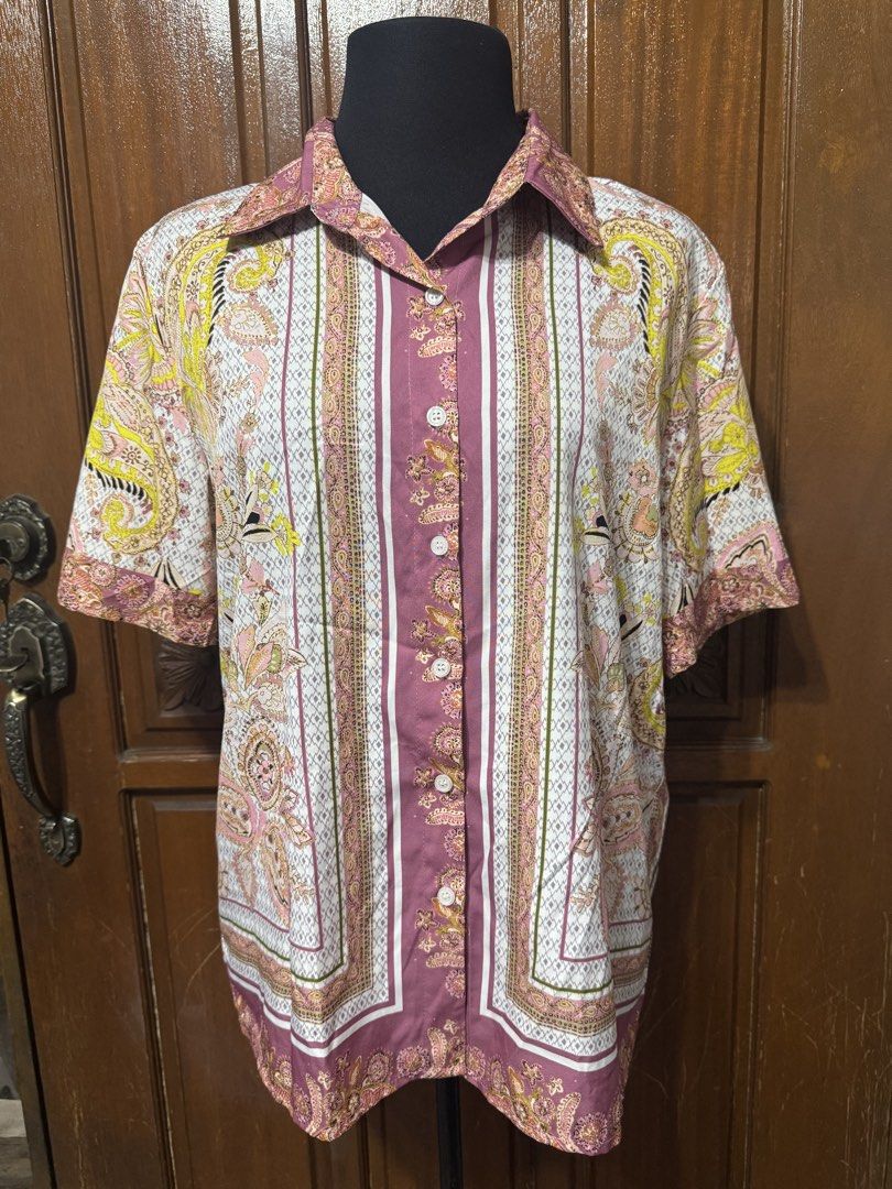 Short Sleeve Button-Up Shirt - Paisley Print (Category: Blouses) located in Manila. Submitted by prelovedshopmnl (Listing ID 1463612874, Image 1). Description: - Cool short sleeve button-up shirt - Vibrant all-over paisley print - Nice collar detail - Can be worn open or buttoned up - Perfect for casual wear.