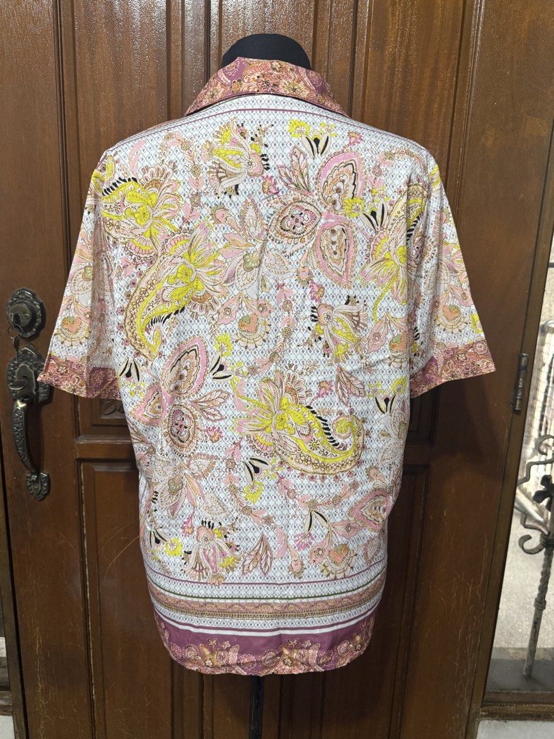 Short Sleeve Button-Up Shirt - Paisley Print (Category: Blouses) located in Manila. Submitted by prelovedshopmnl (Listing ID 1463612874, Image 2). Description: - Cool short sleeve button-up shirt - Vibrant all-over paisley print - Nice collar detail - Can be worn open or buttoned up - Perfect for casual wear.