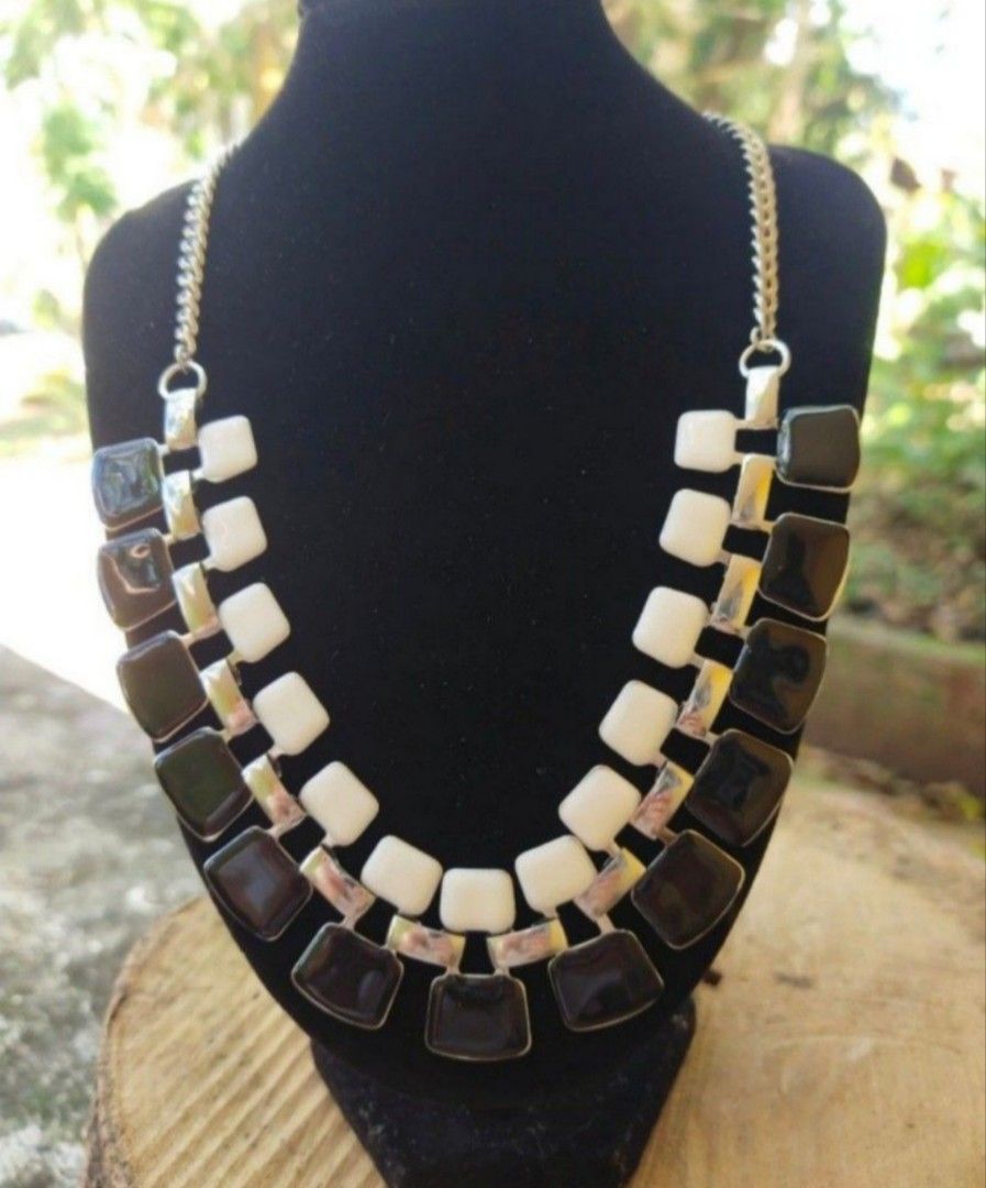 Silver Tone Black & White Statement Necklace (Category: Necklaces) located in Bacolod City. Submitted by jewels.of.joy (Listing ID 1463665889, Image 2). Description: - Chunky silver tone chain french enamel necklace - Features alternating black and white square stones - Statement piece, perfect for dressing up any outfit - Clasp closure with an extender chain - Comes with original tag.