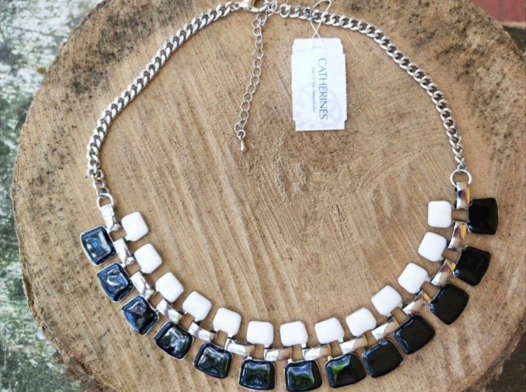 Silver Tone Black & White Statement Necklace (Category: Necklaces) located in Bacolod City. Submitted by jewels.of.joy (Listing ID 1463665889, Image 1). Description: - Chunky silver tone chain french enamel necklace - Features alternating black and white square stones - Statement piece, perfect for dressing up any outfit - Clasp closure with an extender chain - Comes with original tag.