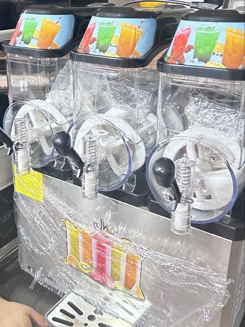 Slush Frozen Drinks and Cocktails Machine (Category: Juicers, Blenders & Grinders) located in Santa Rosa. Submitted by rei.accessories (Listing ID 1463653828, Image 3). Description: - Features three tanks for multiple flavor options. - Perfect for parties, gatherings, and any celebration. -Used for 3 months only.