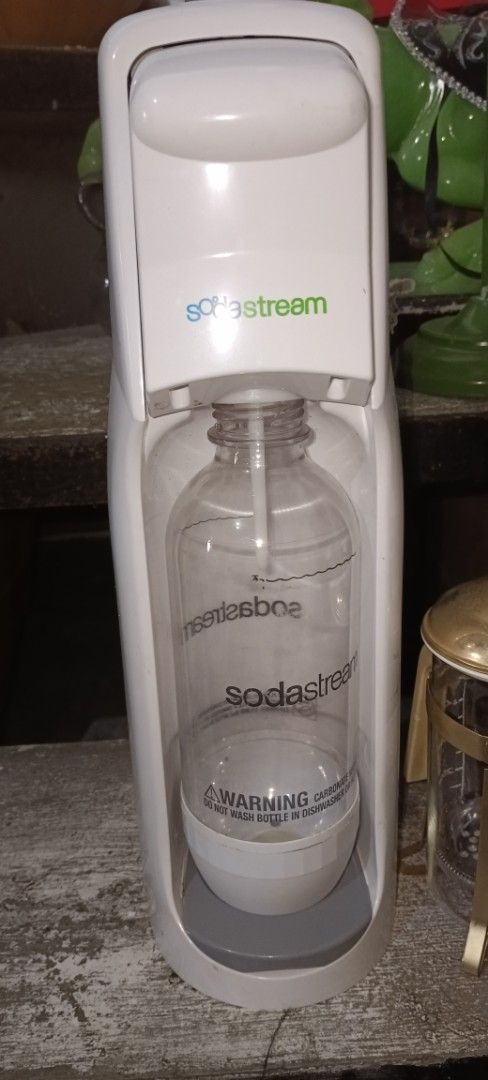 SodaStream Sparkling Water Maker with CO2 Cylinder (Category: Water Purifiers & Dispensers) located in Batangas. Submitted by baning_finds (Listing ID 1463645302, Image 1). Description: - Create sparkling water at home with ease. - Comes with a CO2 cylinder. - Simple operation: just add water and carbonate. - Perfect for making your own custom fizzy drinks..