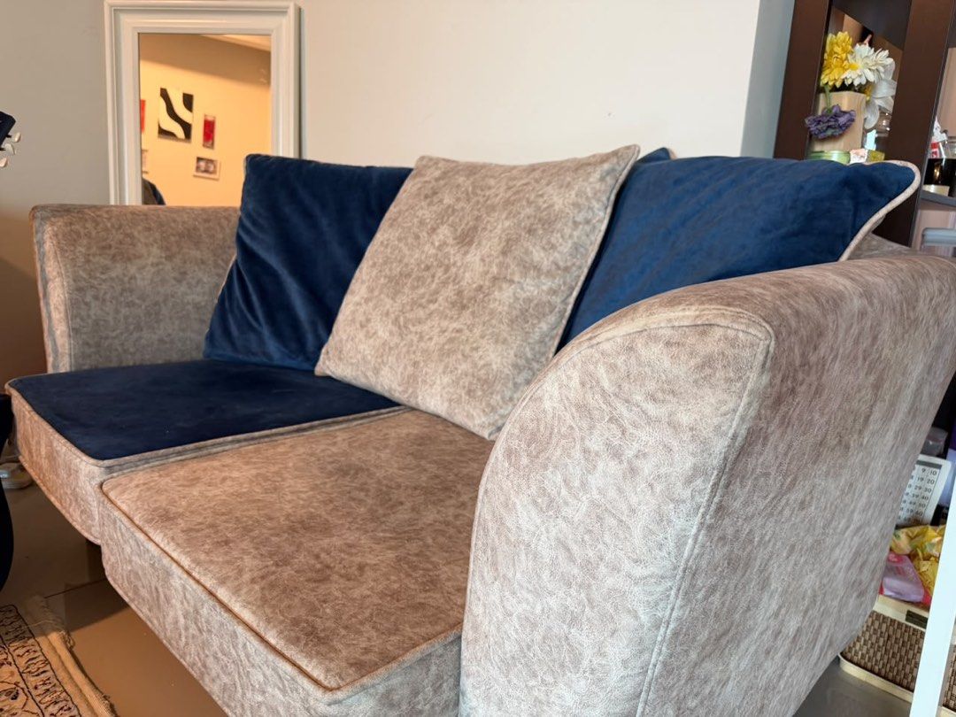 sofa set (Category: Sofas) located in Kuala Lumpur. Submitted by taliehnia (Listing ID 1463568142, Image 2). Description: - Comfy 3-seater sofa - Textured beige fabric upholstery - Contrasting navy blue seat cushions - Includes decorative navy blue throw pillows - Modern design, suitable for most living spaces - Ideal for lounging and relaxing - Ready for a new home.