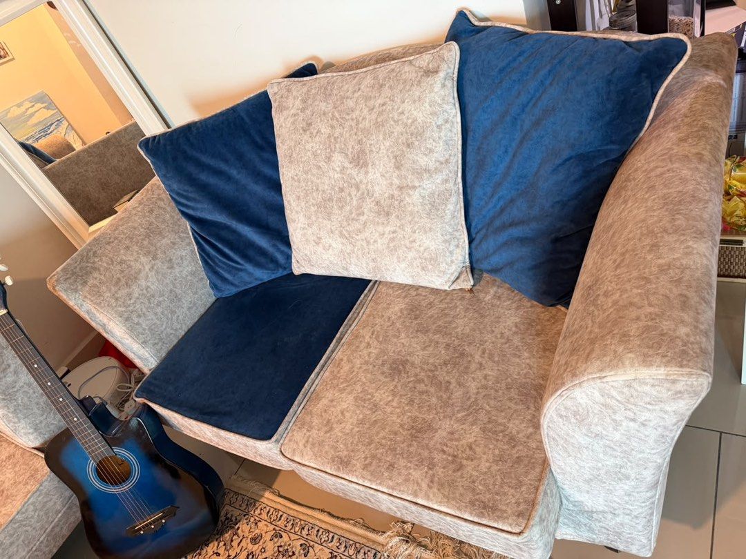 sofa set (Category: Sofas) located in Kuala Lumpur. Submitted by taliehnia (Listing ID 1463568142, Image 3). Description: - Comfy 3-seater sofa - Textured beige fabric upholstery - Contrasting navy blue seat cushions - Includes decorative navy blue throw pillows - Modern design, suitable for most living spaces - Ideal for lounging and relaxing - Ready for a new home.