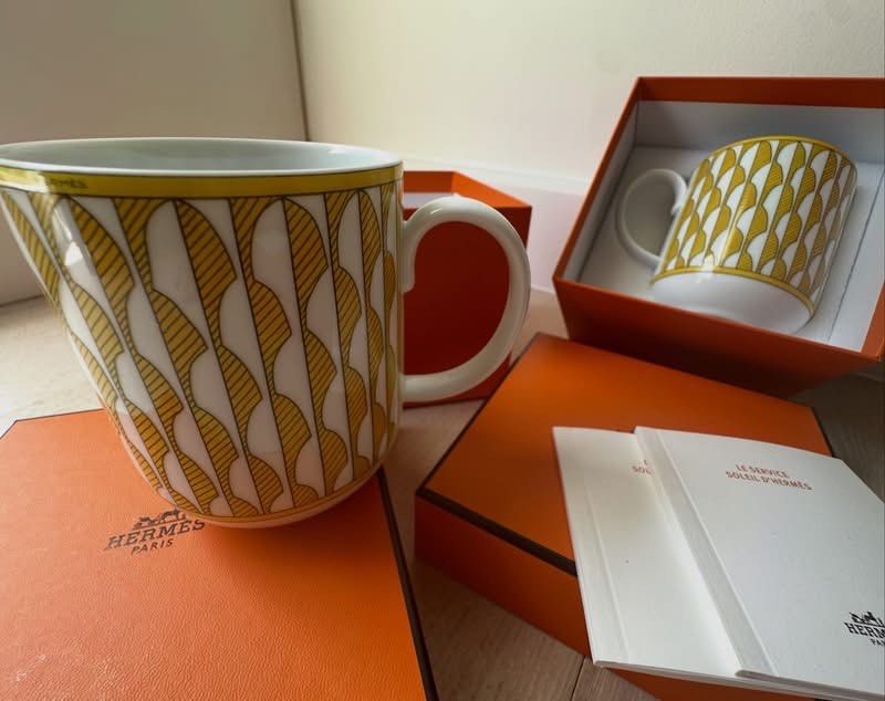 Soleil d'Hermes Mugs (Category: Coffee & Tea Tableware) located in Cainta. Submitted by kairus.luckyfind (Listing ID 1463668476, Image 2). Description: - Authentic Hermes mugs - From the 'Soleil d'Hermes' collection - Features a charming yellow and white pattern - Includes original orange Hermes boxes - Comes with accompanying paperwork - Proudly made in France - Ideal for gifting or personal collection - P10k each, nego for sure buyers only.
