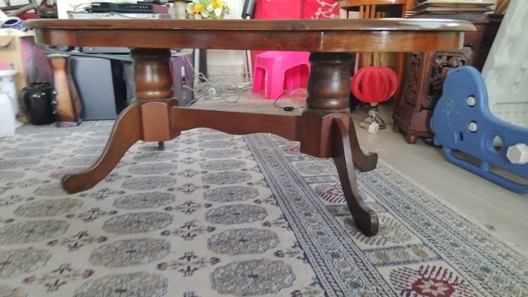 Solid Wood Coffee Table (Category: Tables & Sets) located in Kuala Lumpur. Submitted by amirulfik93 (Listing ID 1463700542, Image 2). Description: Solid wood oval coffee table. Dark brown wood finish. Sturdy pedestal base with curved legs. Some minor scuffs on the surface from normal use. Approx. 110cm x 60cm x 45cm(H) Self pickup from Taman Melati.