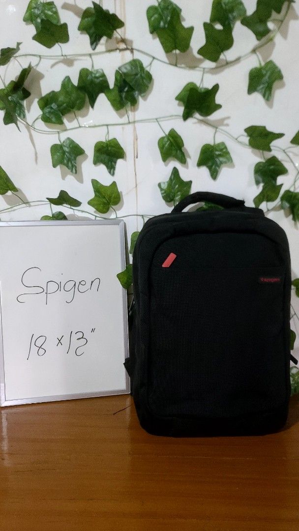 Spigen Backpack 18" x 13" (Category: Backpacks) located in Baguio. Submitted by phoeberose33384 (Listing ID 1463739705, Image 1). Description: - Black Spigen backpack - Dimensions: 18 inches x 13 inches - Features adjustable straps and zippers - Perfect for carrying your daily essentials - Shows some signs of wear.