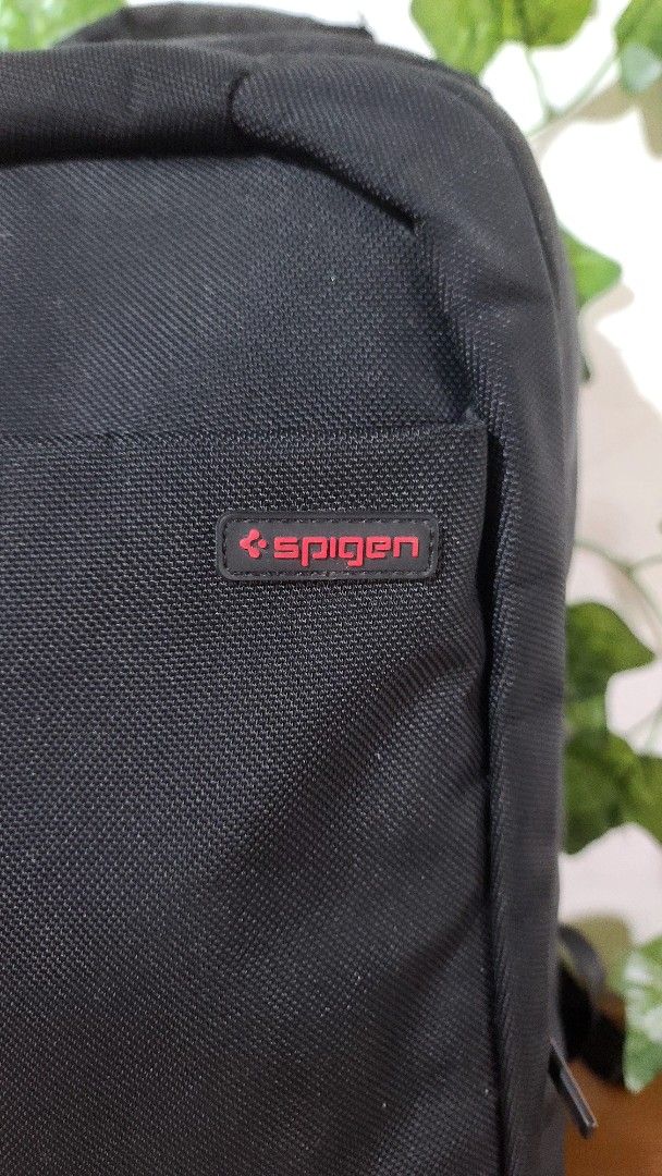 Spigen Backpack 18" x 13" (Category: Backpacks) located in Baguio. Submitted by phoeberose33384 (Listing ID 1463739705, Image 2). Description: - Black Spigen backpack - Dimensions: 18 inches x 13 inches - Features adjustable straps and zippers - Perfect for carrying your daily essentials - Shows some signs of wear.