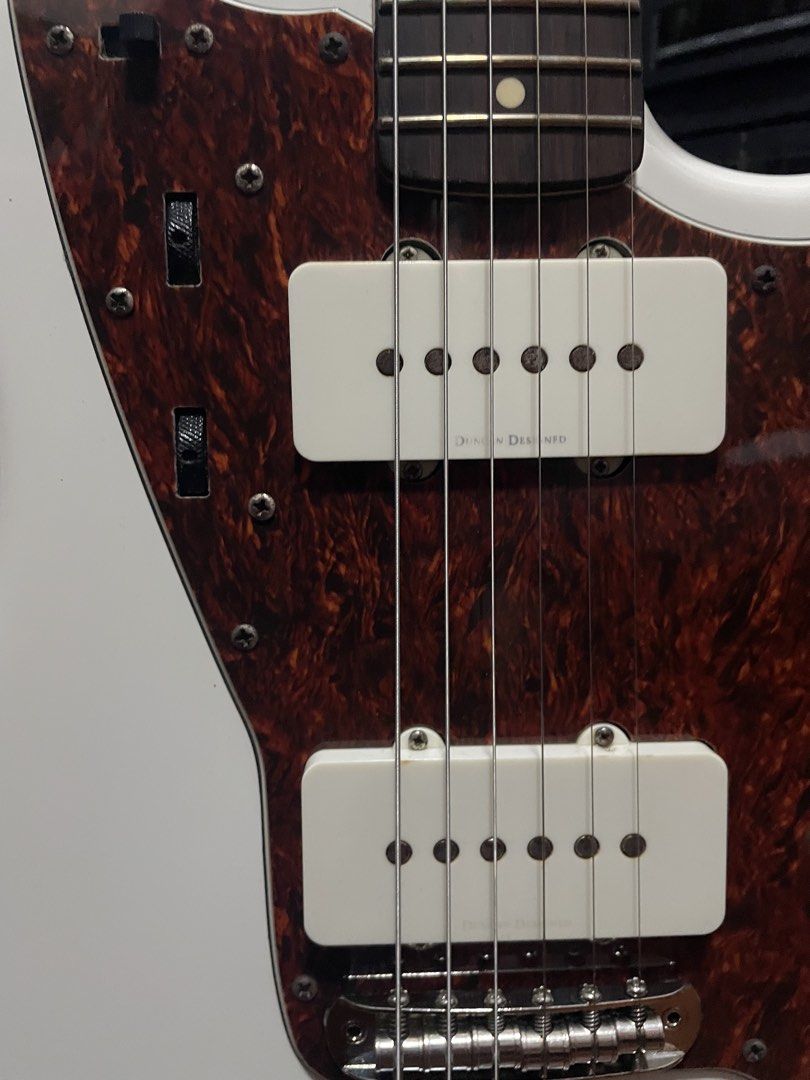 Squier Vintage Modified Jazzmaster – Duncan Designed Pickups – Upgraded Bridge (Category: Musical Instruments) located in Pasig City. Submitted by janssensei (Listing ID 1463679757, Image 3). Description: Selling my Squier Vintage Modified Jazzmaster, Indonesian-made. Bought in 2019 and very well cared for. Recently professionally set up and and ready to play. Details * Duncan Designed Jazzmaster pickups * Elixir 10s * Upgraded bridge with rollin