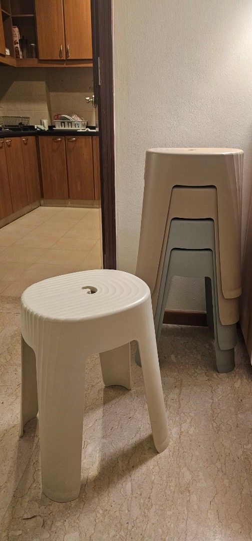 Stackable Plastic Stools (Category: Chairs) located in Singapore. Submitted by tjpoonfami71004 (Listing ID 1463692845, Image 1). Description: - Colors: 1White, Light Beige/Grey - Perfect for extra seating - Stacks neatly for easy storage - Suitable for kitchens, playrooms, or outdoor use -SGD5 each.