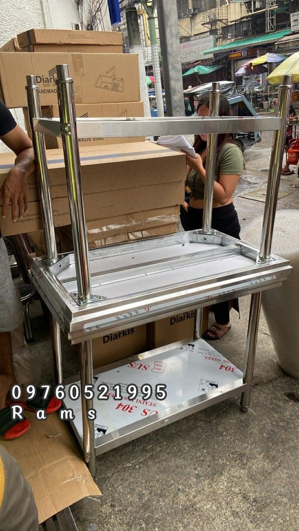 Stainless Steel Work Table with Shelves - Various Sizes Available (Category: Tables & Sets) located in Manila. Submitted by acykt18 (Listing ID 1463723974, Image 3). Description: - Heavy duty stainless steel construction - Ideal for kitchen or workshop environments - Includes two shelves for ample storage - Available in various sizes - Durable and easy to maintain - Contact us for specific dimensions and pricing.
