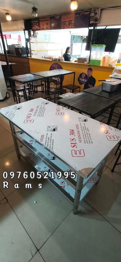 Stainless Steel Work Table with Shelves - Various Sizes Available (Category: Tables & Sets) located in Manila. Submitted by acykt18 (Listing ID 1463723974, Image 1). Description: - Heavy duty stainless steel construction - Ideal for kitchen or workshop environments - Includes two shelves for ample storage - Available in various sizes - Durable and easy to maintain - Contact us for specific dimensions and pricing.