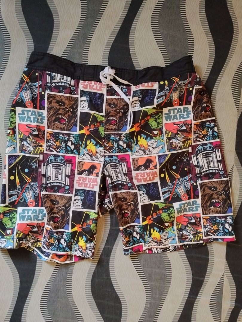 Star Wars Comic Print Swim Shorts (Category: Swim Trunks & Board Shorts) located in Manila. Submitted by titokingcuratedarchive (Listing ID 1463737124, Image 1). Description: - Awesome Star Wars themed swim shorts - Features a fun comic book style print with Chewbacca and R2-D2 - Comfortable elastic waistband with adjustable drawstring - Built-in mesh lining for support - Ideal for swimming, beach days, or pool parties Size : L ( 36W).