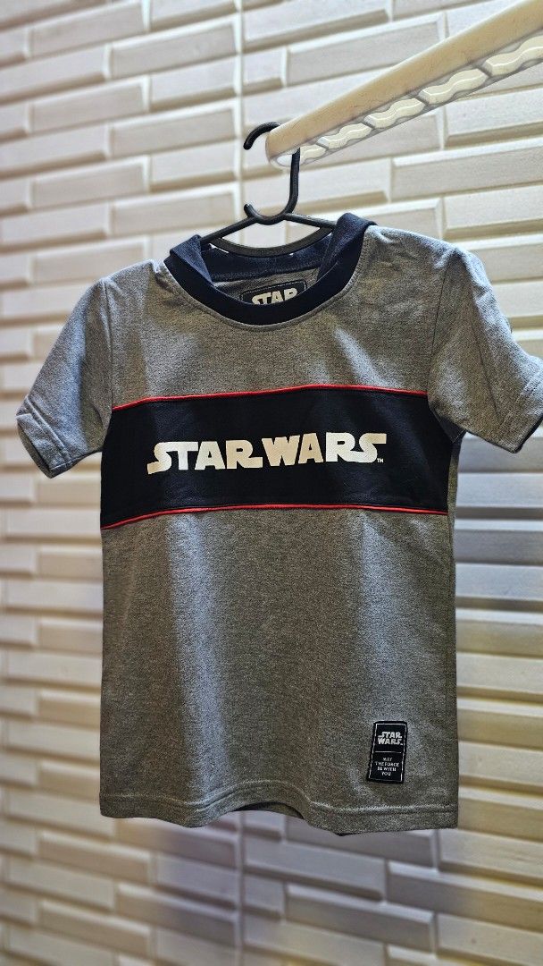 Star Wars Grey T-Shirt with Darth Vader Patch - Size 8 (Category: Shirts) located in Quezon City. Submitted by dawnest (Listing ID 1463642394, Image 1). Description: - Grey Star Wars T-shirt - Features iconic Star Wars logo with red stripe - Cool Darth Vader patch on sleeve - 14.5 inches width, 20 inches length - Size 8 - Ideal for any Star Wars enthusiast.