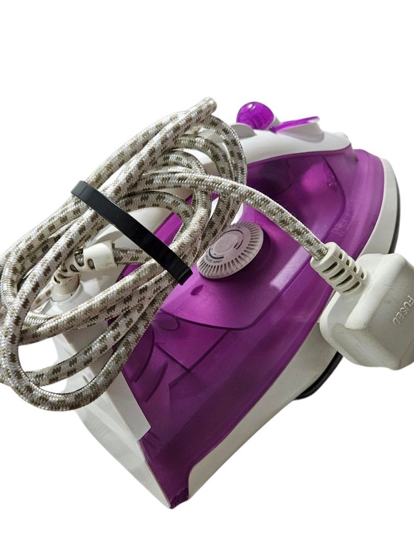 Steam Iron (Category: Irons & Steamers) located in Quezon City. Submitted by kirstenbella (Listing ID 1463581872, Image 2). Description: - Steam iron - Purple and white - Elpine from Australia - Built-in water tank for steam function - Adjustable temperature control dial - No issue works perfectly fine - 220V 1600W.