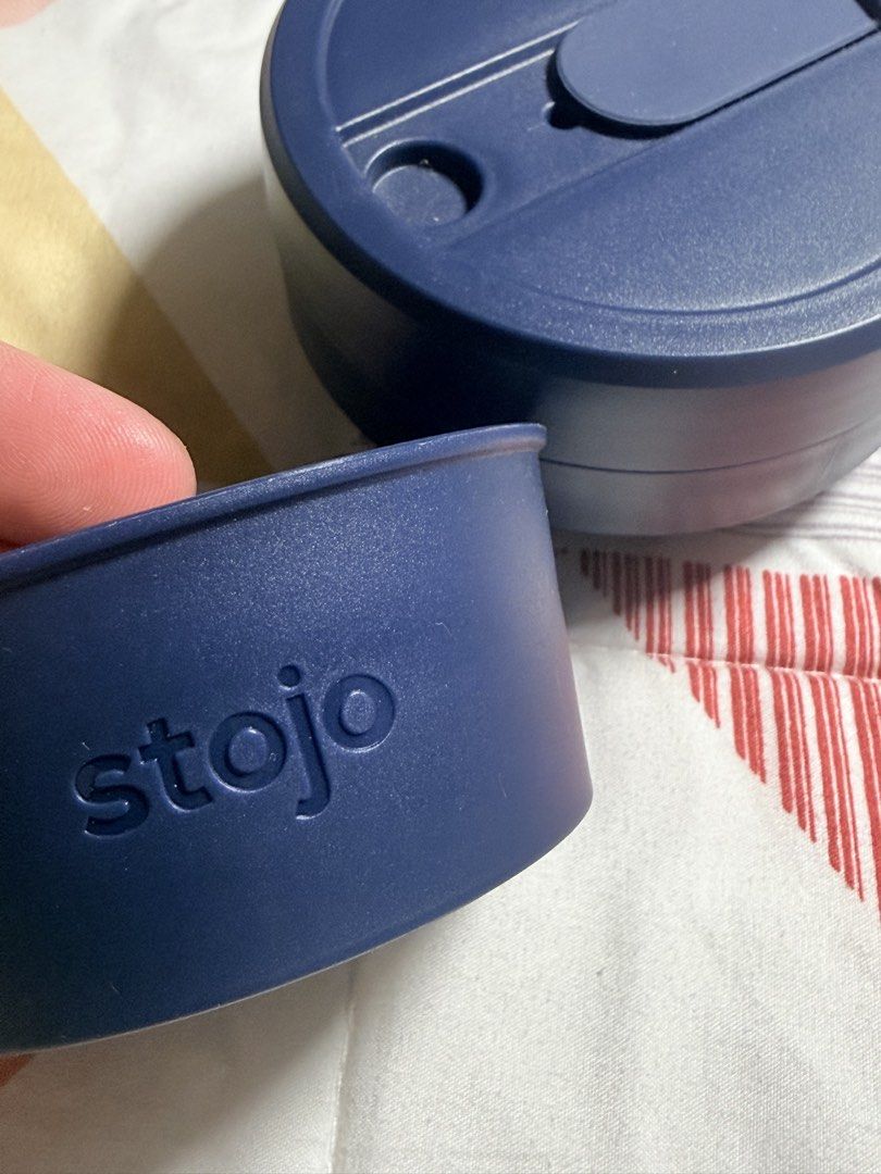 Stojo Navy Blue Collapsible Silicone Cup (Category: Water Bottles & Tumblers) located in Quezon City. Submitted by closetcleanupbyla.esq (Listing ID 1463695780, Image 3). Description: - Navy blue Stojo collapsible cup - Made of durable silicone - Includes a secure lid and a comfortable grip band - Folds down flat for ultimate portability and easy storage - Perfect for coffee, tea, and other beverages on the go - Reusable and eco-friendly alternat