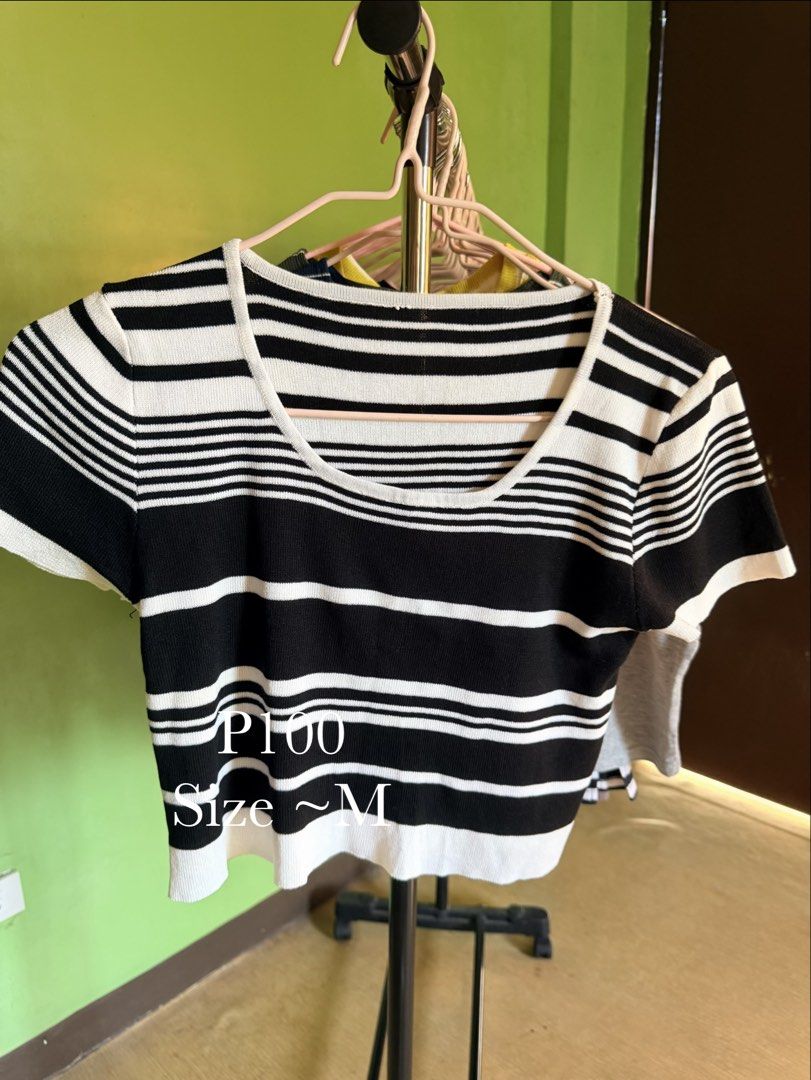 Striped Cropped Knit Top (Category: Blouses) located in Muntinlupa City. Submitted by cocofinds023 (Listing ID 1463711815, Image 1). Description: - Classic black and white stripes - Knit crop top style - Short sleeves - Flattering scoop neckline - Stretchy material for comfort - Fits like a size Medium - Versatile for casual outfits or layering - Pairs perfectly with high-waisted jeans or skirts.