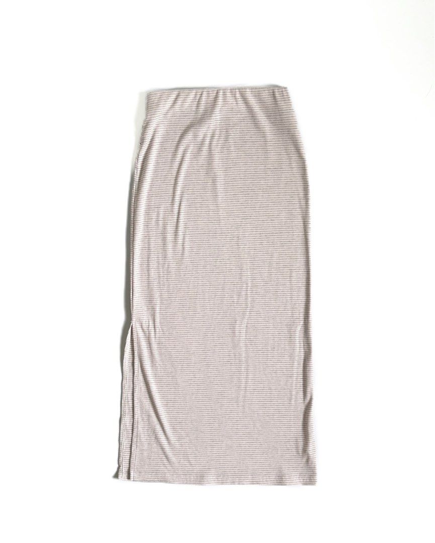 Striped Midi Skirt with Side Slit (Category: Skirts) located in Tarlac. Submitted by kr_closet (Listing ID 1463674121, Image 1). Description: - Lightweight midi skirt - Subtle beige and white pinstripe pattern - Side slit for easy movement - Comfortable stretchy waistband - Perfect for casual or dressed-up outfits.