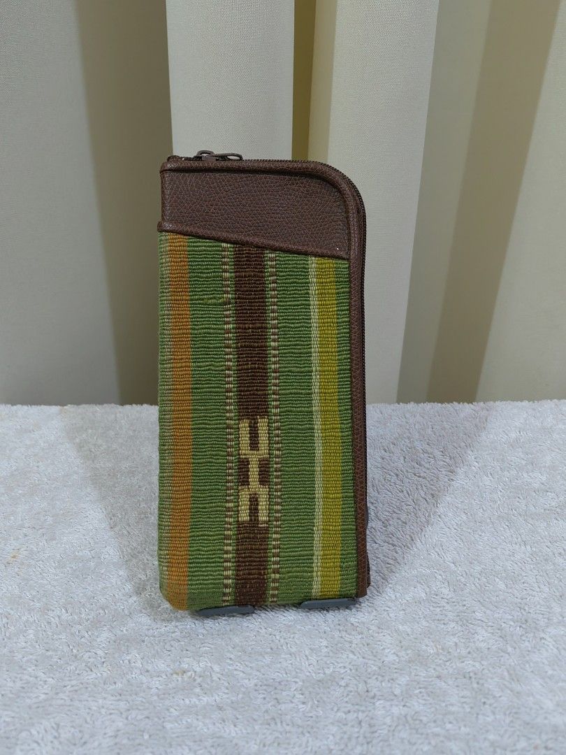 Sunglasses Pouch (Category: Purses & Pouches) located in Makati City. Submitted by prelovedtreatedwithlove (Listing ID 1463739166, Image 1). Description: - Adorable woven striped pouch - Stylish brown leather trim at the top - Secure zipper closure - Dark fabric lining inside - Ideal for organizing small items and essentials but best fit for sunglasses .