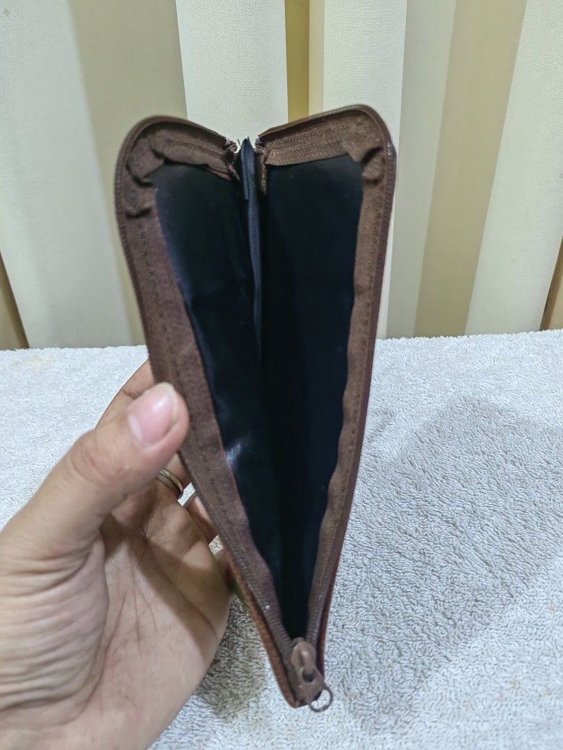 Sunglasses Pouch (Category: Purses & Pouches) located in Makati City. Submitted by prelovedtreatedwithlove (Listing ID 1463739166, Image 2). Description: - Adorable woven striped pouch - Stylish brown leather trim at the top - Secure zipper closure - Dark fabric lining inside - Ideal for organizing small items and essentials but best fit for sunglasses .