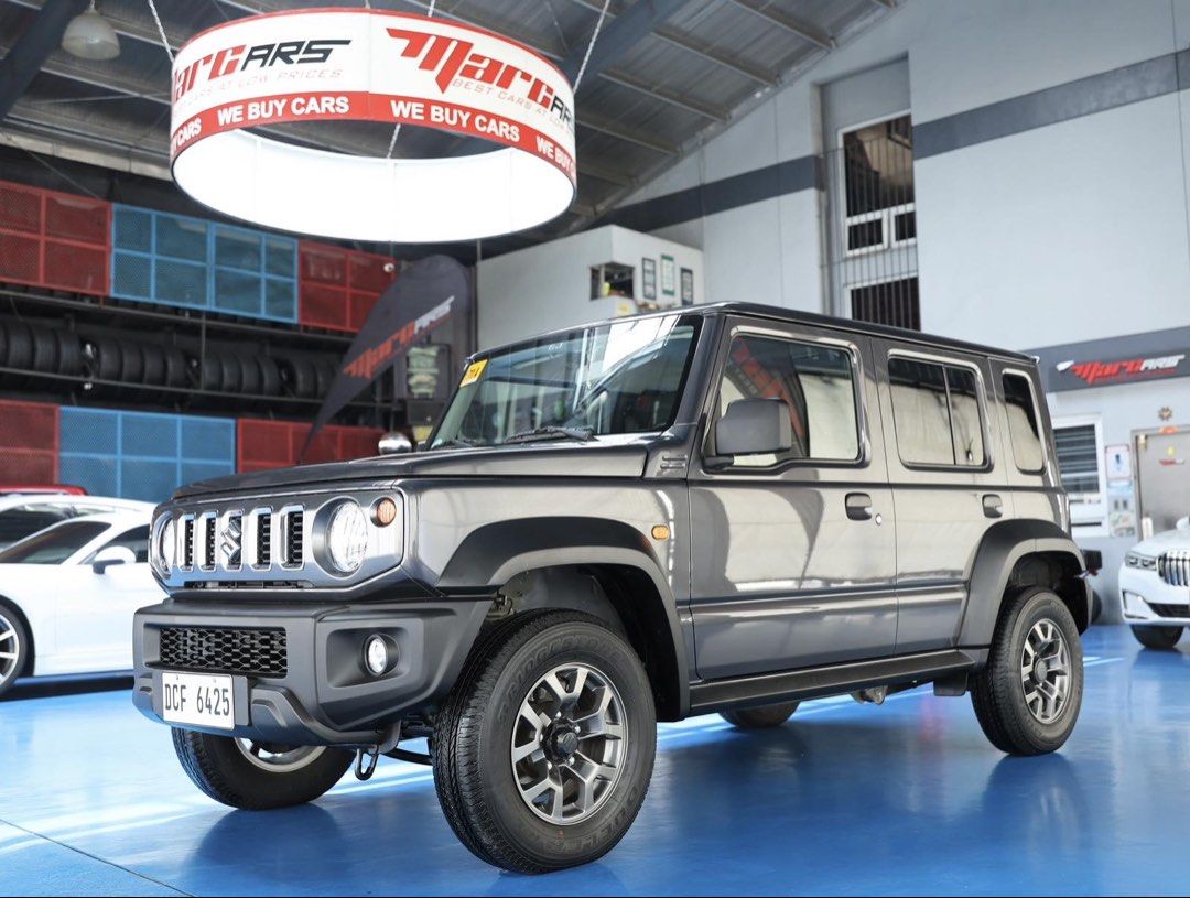 Suzuki Jimny Manual (Category: Used Cars) located in Quezon City. Submitted by marcars_trading (Listing ID 1463572165, Image 3). Description: 2025’s Suzuki JIMNY GL M/T 5-Door 1.230M (neg) trade in ok! 1,300kms ONLY! SUPER LOW MILEAGE! GOOD as BRANDNEW! IMMACULATE, VERY FRESH & PRESERVED Condition Must see to believe - 1st owner - Complete owner's manual, booklets & spare key - 1.5L 16valve 4CYL GAS Engine - 100HP (0 to 100kph in 12 seconds) - 5s