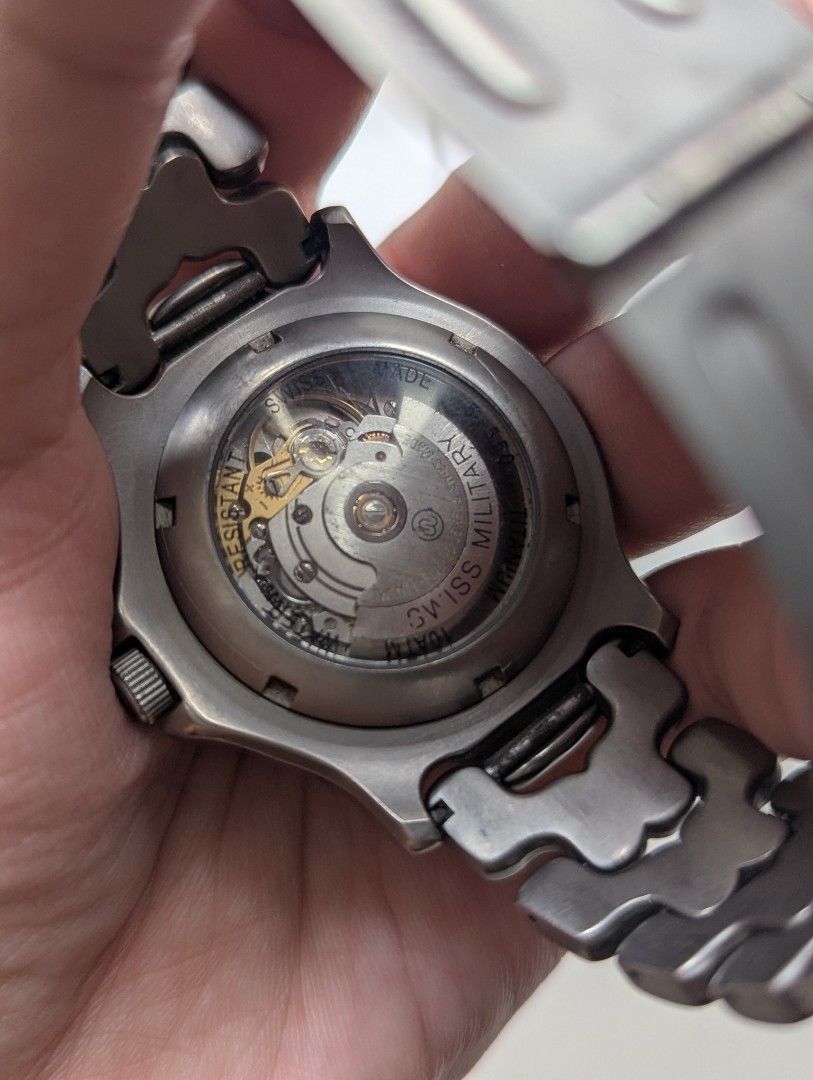 Swiss Army Automatic Full Titanium Watch (Category: Luxury Watches) located in Quezon City. Submitted by dustydialsph (Listing ID 1463661032, Image 2). Description: - Swiss Army Automatic Watch - Dark Dial with Luminous Hands & Markers - Date Window at 3 o'clock - Stainless Steel Bracelet with Fold-over Clasp - See-Through Caseback to View Movement - Classic Design for Everyday Wear.