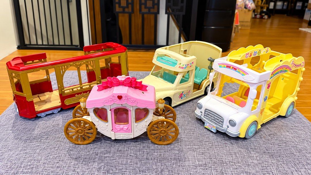 Sylvanian Families Vehicles (Category: Kids Toys) located in Quezon City. Submitted by charleystoystore (Listing ID 1463590780, Image 3). Description: Picture 1: School bus-1,500 Orange car-750 Vintage Wedding Car-2,500 School bus with slide- 550 School bus-380 Picture 2: Green car-1,000 each Red car-450 each White black car-1,000 Picture 3: Tram-750 Carriage-1,000 Camper-van-1000 Yellow bus-700 Picture 4: Boat house-1,000 What you see is what yo