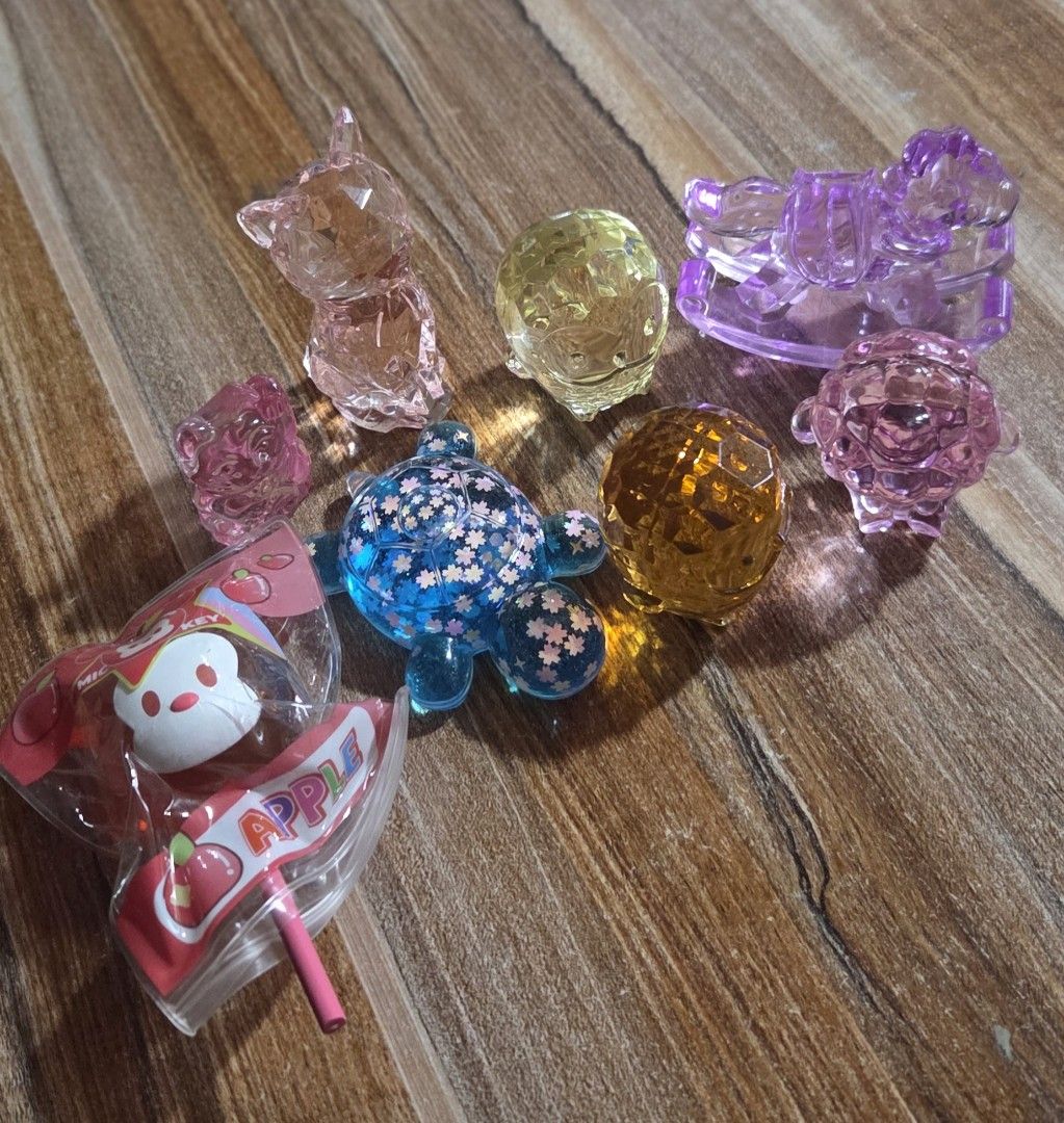 TAKE ALL Cute Crystal Animal Figurines - Assorted Colors (Category: Designer & Blind Box Toys) located in Buguias. Submitted by pufflydeclutter_ph (Listing ID 1463627074, Image 1). Description: - Adorable crystal figurines perfect for display or gifting. - Collection includes: Pink Cat, Pink Bear, Blue Turtle, Yellow Crystal, Orange Crystal, Purple Rocking Horse, Pink Sheep. - Beautifully catch the light and add a touch of sparkle. - Great as sma