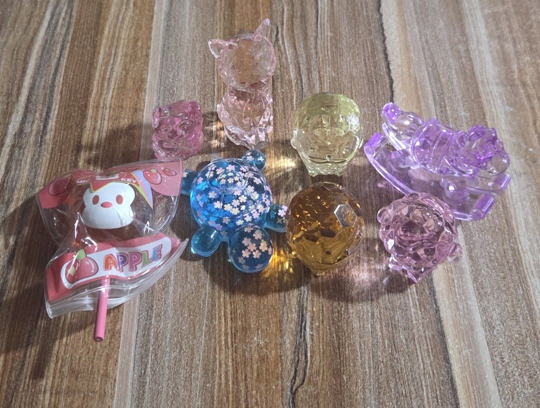 TAKE ALL Cute Crystal Animal Figurines - Assorted Colors (Category: Designer & Blind Box Toys) located in Buguias. Submitted by pufflydeclutter_ph (Listing ID 1463627074, Image 2). Description: - Adorable crystal figurines perfect for display or gifting. - Collection includes: Pink Cat, Pink Bear, Blue Turtle, Yellow Crystal, Orange Crystal, Purple Rocking Horse, Pink Sheep. - Beautifully catch the light and add a touch of sparkle. - Great as sma
