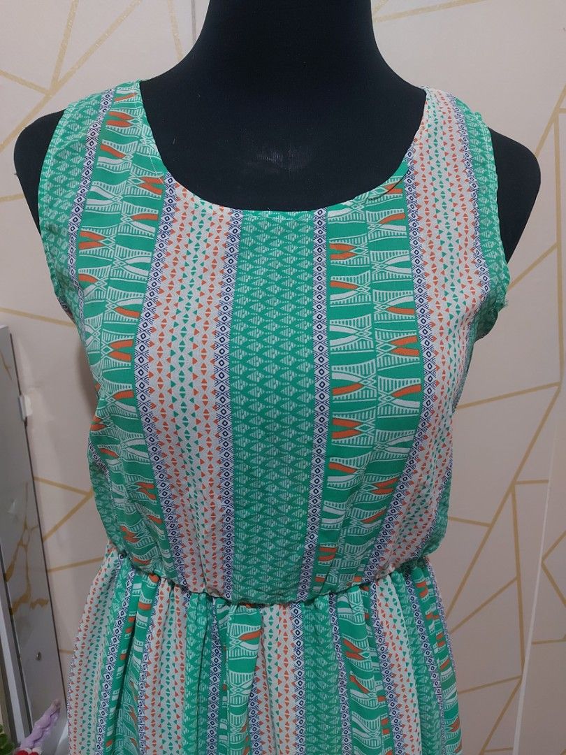 Teal Geometric Print Maxi Dress (FREESIZE) (Category: Dresses) located in Manila. Submitted by jollyann_b1990 (Listing ID 1463643154, Image 3). Description: - Freesize maxi dress - Teal base with white, orange, and blue geometric print - Cinched waist for a flattering fit - Sleeveless design - Comfortable round neckline - Ideal for casual outings or beach days - Easy to wear and very comfortable.