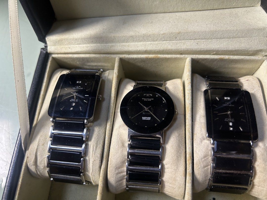 Technos Swiss Sapphire Ceramic Watches (3 pcs) (Category: Men's Watches) located in Cavite. Submitted by mamamia73 (Listing ID 1463718901, Image 1). Description: - Set of 3 Technos Swiss watches - Includes 2 rectangular face and 1 round face watch - All watches have black ceramic bands and faces - Features durable sapphire crystal - Versatile for everyday wear or special occasions 2500 each all in working condition .