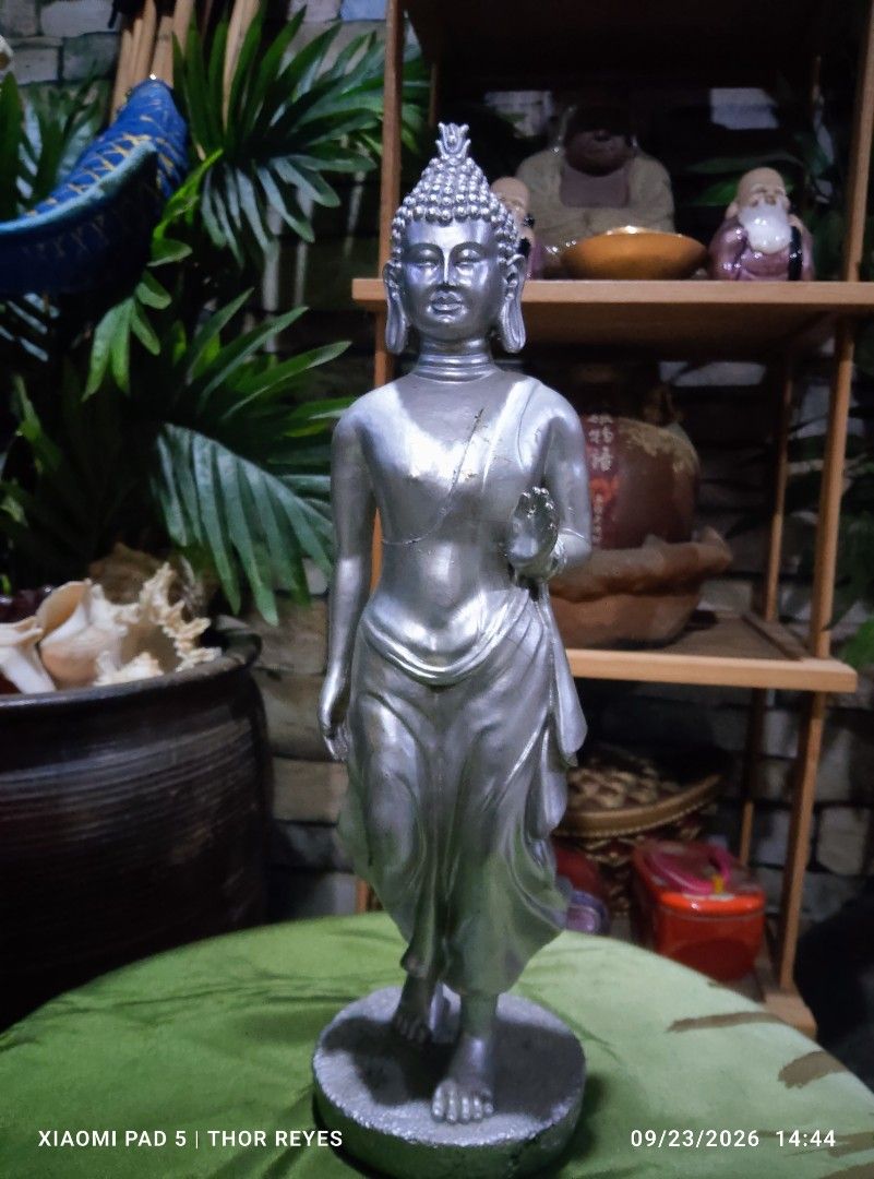 Thai Standing Silver Buddha (9 inches height) (Category: Other Home Decor) located in Valenzuela. Submitted by mighthor0526 (Listing ID 1463619364, Image 2). Description: Material: Resin in silver finish Preloved item, no issue Payment thru Gcash or Abono by Lalamove rider Delivery by rider or shipping will be shouldered by the buyer Pm me if interested .