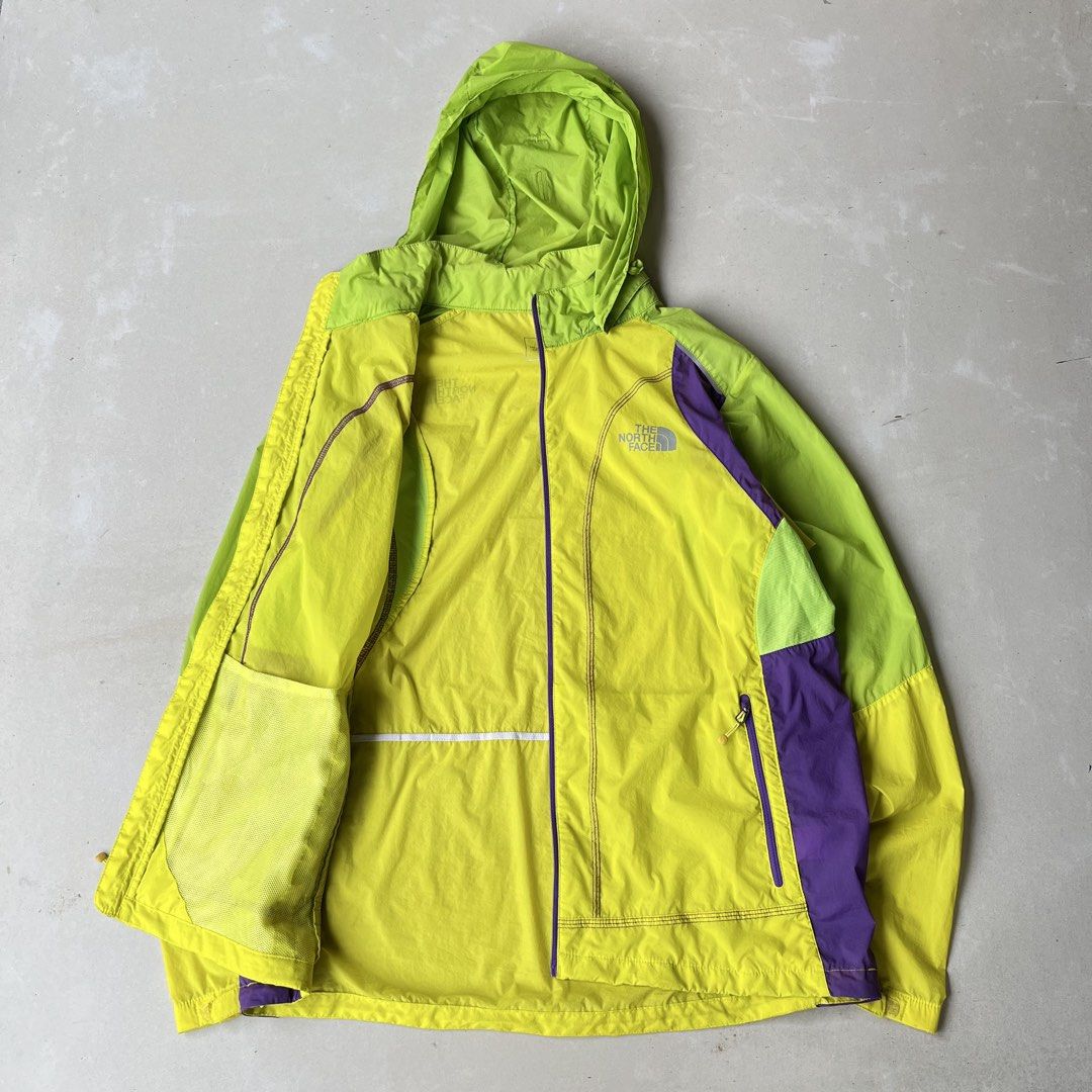 The North Face Lightweight Hooded Jacket Size M (Category: Coats, Jackets and Outerwear) located in Mandaue City. Submitted by chinsyap_03 (Listing ID 1463652899, Image 3). Description: - Brand: The North Face - Color: Bright Yellow with Lime Green & Purple accents - Style: Lightweight Hooded Jacket - Features: Full zip front, 2 zippered pockets - Ideal for: Outdoor activities, casual wear - Special Feature: Very light and packable.