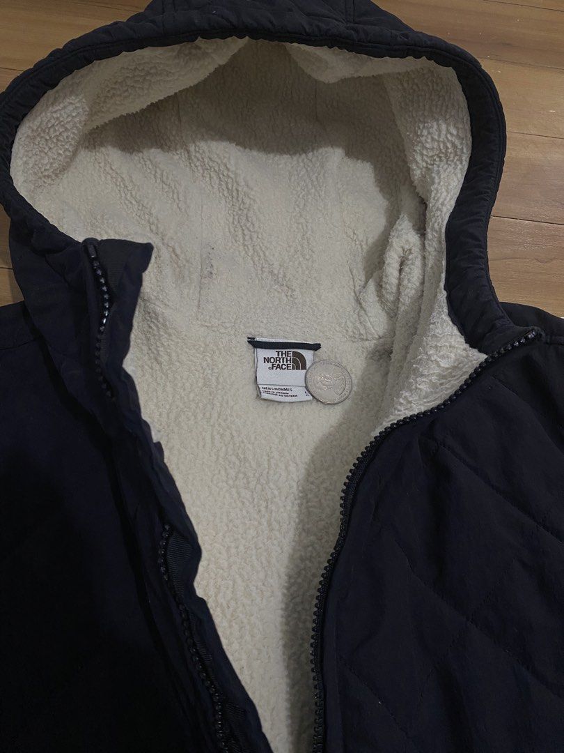 The North Face Quilted Sherpa Lined Hooded Jacket (Category: Coats, Jackets and Outerwear) located in Caloocan City. Submitted by NotYetDressed (Listing ID 1463716532, Image 2). Description: - Navy blue quilted jacket from The North Face - Lined with warm sherpa fleece - Full zip front closure - Two convenient front pockets - Hood is also lined for extra warmth - Made in Vietnam - Size: Large.