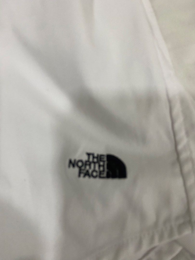 The North Face White Button Up Shirt Size S (Category: Formal Shirts) located in Quezon City. Submitted by michaelan71320 (Listing ID 1463710202, Image 2). Description: - Brand: The North Face - Color: White - Size: S - Style: Classic button-up shirt - Features: Classic collar with button closure - Design: Simple and clean - Occasion: Casual or smart-casual wear - Measurements: Approximately 21 inches across the chest, 30 inches in length.