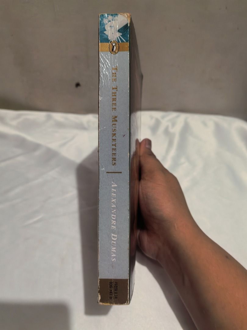 The Three Musketeers by Alexandre Dumas Puffin Classics (Category: Storybooks) located in Malabon City. Submitted by royalforest_2ba32f (Listing ID 1463738086, Image 2). Description: 📚 The Three Musketeers — Alexandre Dumas Puffin Classics Preloved copy with visible signs of age and use. Cover has some creases, scratches, and edge/spine wear, but still a nice reading copy. Please refer to the actual photos for the exact condition. Details: • Aut