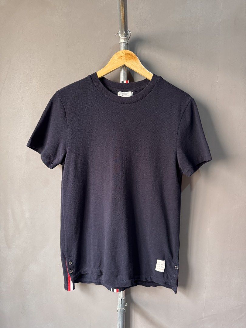 Thom Browne - Grosgrain Back Stripe Navy Tshirt (Category: Activewear) located in Cabuyao City. Submitted by _streetflavor (Listing ID 1463678575, Image 1). Description: Thom Browne - Grosgrain Back Stripe Navy Tshirt Excellent Size: 2 on tag fits medium Length: 25.5/27 Width: 19 -1880 pesos Dm.