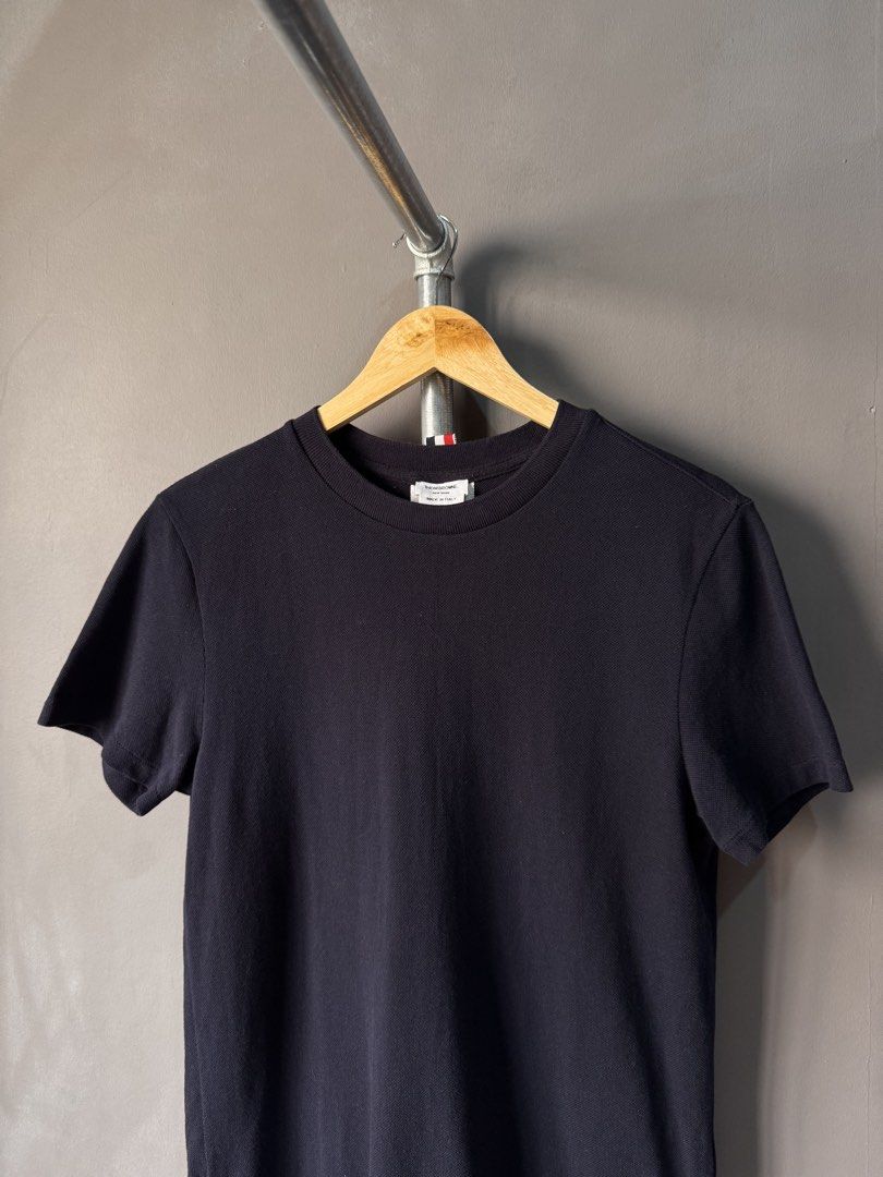 Thom Browne - Grosgrain Back Stripe Navy Tshirt (Category: Activewear) located in Cabuyao City. Submitted by _streetflavor (Listing ID 1463678575, Image 2). Description: Thom Browne - Grosgrain Back Stripe Navy Tshirt Excellent Size: 2 on tag fits medium Length: 25.5/27 Width: 19 -1880 pesos Dm.