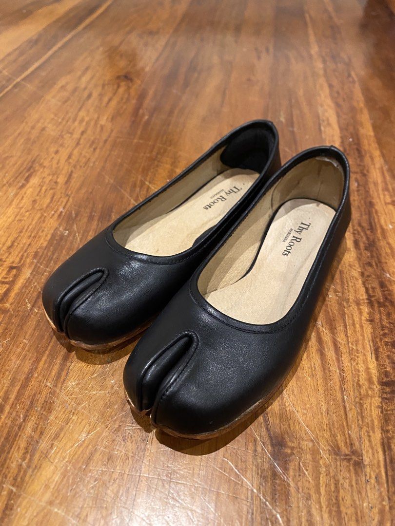 Thy Roots Black Tabi Ballerina Shoes (Category: Flats & Sandals) located in Makati City. Submitted by vanillasugar_ (Listing ID 1463663067, Image 2). Description: - Brand: Thy Roots Marikina - Style: Tabi Ballerina Flats - Color: Black - Material: Leather - Size: 7 - Features: Unique split-toe design RFS: Wrong size. Used only once. Soles showed discoloration when I attempted to clean them. Bought them for 6.5k..