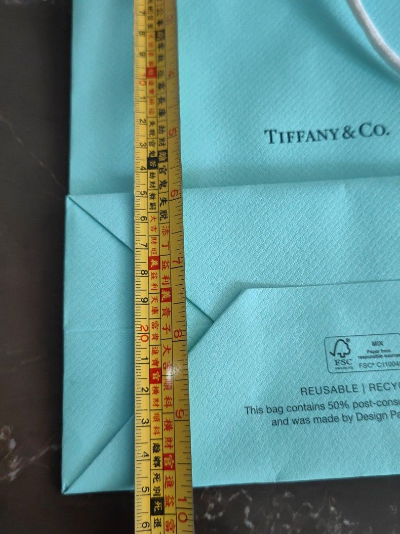 Tiffany & Co. Paper Shopping Bag (Category: Tote Bags) located in Makati City. Submitted by kruelscloset (Listing ID 1463603717, Image 3). Description: - Authentic Tiffany & Co. paper shopping bag - Classic Tiffany blue color - Made with 50% post-consumer recycled material - Reusable and recyclable - Great for gifting or storage - Approximate dimensions: 8 inches tall x 6 inches wide - 200 each.