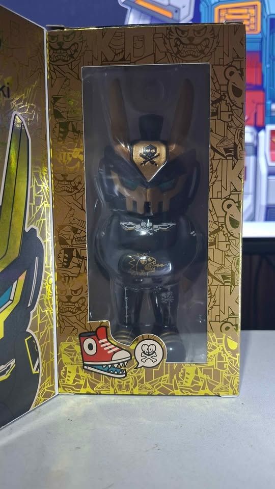 Tokidoki TE063 Quiccs Black Tiger (Category: Designer & Blind Box Toys) located in Imus. Submitted by ToyBlazePH (Listing ID 1463611386, Image 1). Description: - Tokidoki TE063 designer toy - Black and gold colorway - Features a skull motif - Comes in original packaging - Unique robotic/skull figure design - Box has cool camouflage and skull graphics - Perfect for collectors.
