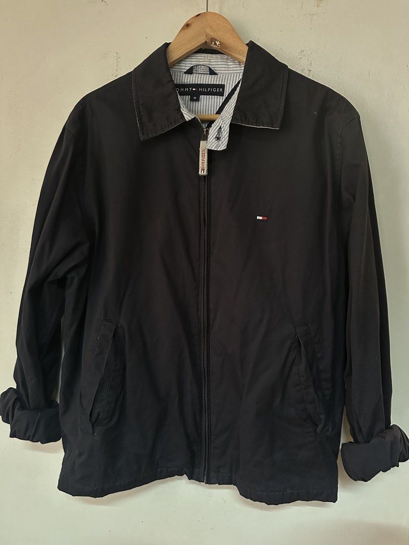 Tommy Hilfiger Harrington Jacket (Category: Coats, Jackets and Outerwear) located in Makati City. Submitted by hotwheels_house (Listing ID 1463587445, Image 1). Description: - 26x22 ( 9/10 cond) - Features iconic Tommy flag logo on chest and back - Zip closure with branded pull tab - Two front pockets - Striped lining and breathable mesh lining - Ideal for casual wear.