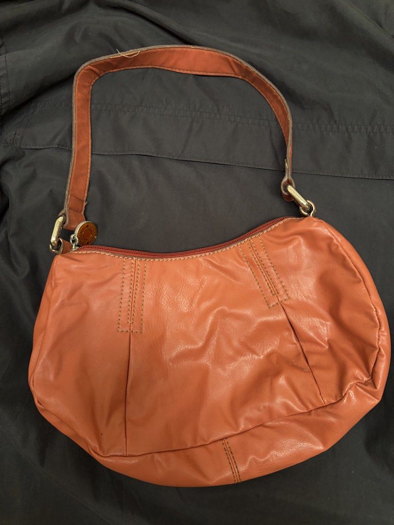 Tommy Hilfiger Orange Leather Shoulder Bag (Category: Shoulder Bags) located in Baliuag. Submitted by asdfraks (Listing ID 1463614859, Image 1). Description: - Authentic Tommy Hilfiger orange leather shoulder bag - ₱450 pesos - rfs: needs funds - jnt/flash shipping.