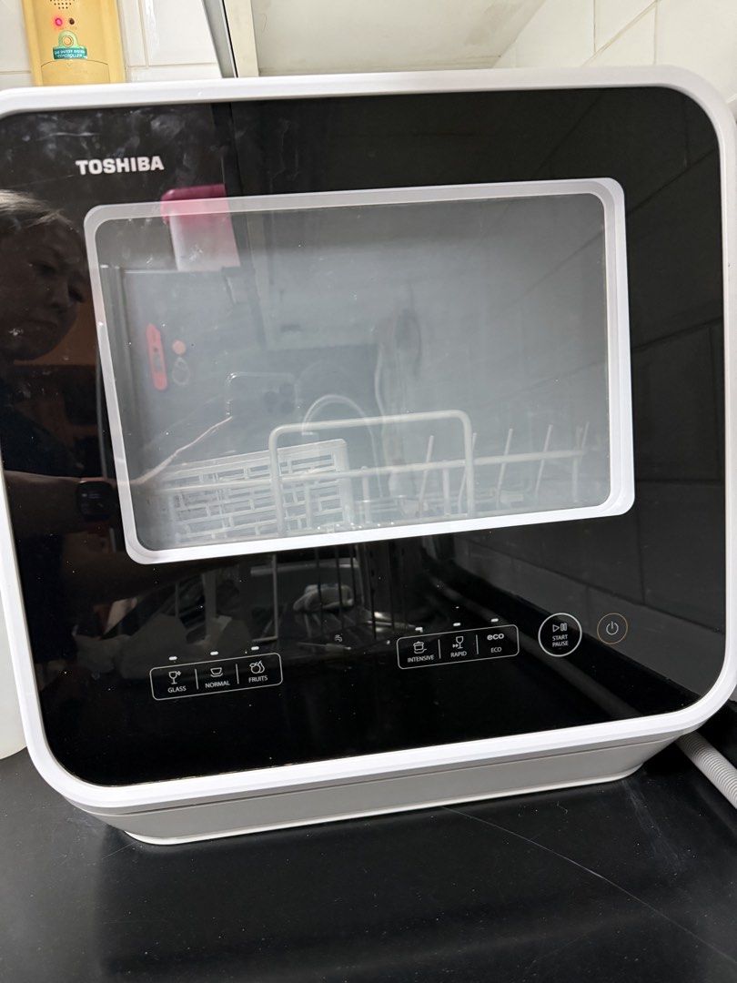 Toshiba 5L Mini Dishwasher 4 Set DWS-22APH(K) (Category: Dishwasher) located in Taguig. Submitted by quickfire_275770 (Listing ID 1463668697, Image 2). Description: - Toshiba Mini Dishwasher - Model: DWS-22APH(K) - Capacity: 5 Liters (fits 4 sets of dishes) - Features: Multiple wash options, 360-degree wash - Compact design, ideal for small spaces Purchased price: 19500 php Purchased date : Mar 2024 Still working well. Partially rusted in the inn
