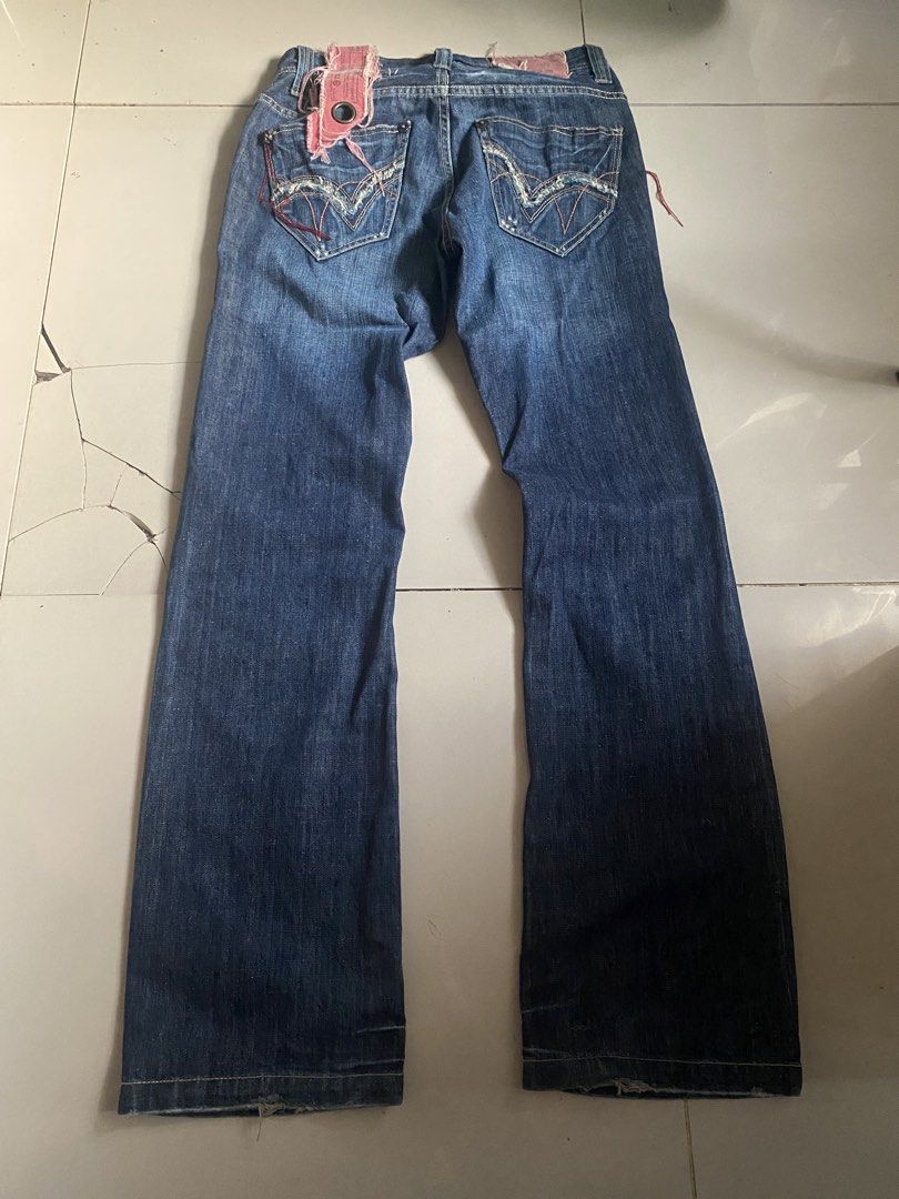 TOUGH Jeansmith Denim Jeans (Category: Jeans) located in Quezon City. Submitted by beepboop2506 (Listing ID 1463736032, Image 2). Description: - Brand: TOUGH Jeansmith - Color: Blue Denim - Style: Straight Leg - Features: Distressed details throughout, unique stitching on back pockets, button fly closure.