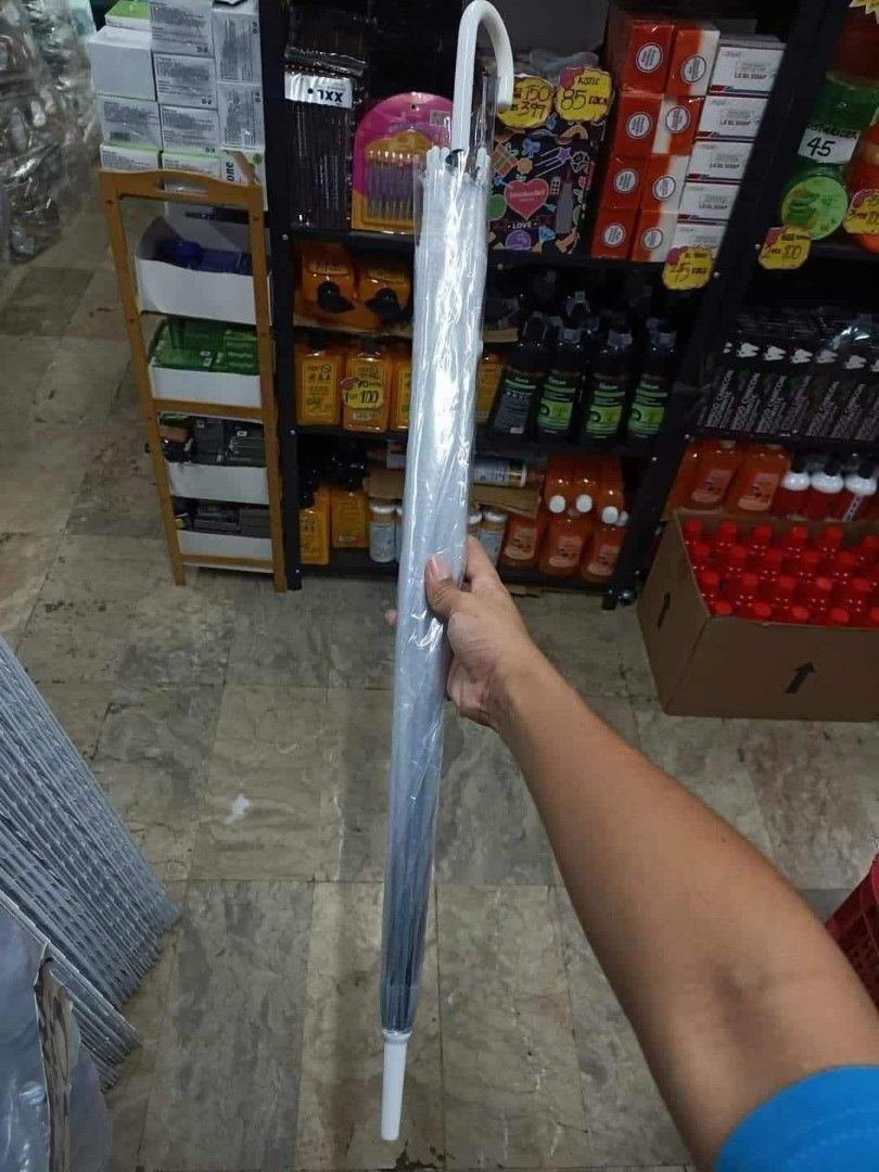 TRANSPARENT UMBRELLA LONG HANDLE SIZE:76CM X 70CM (Category: Umbrellas) located in Quezon City. Submitted by miriamreyes006 (Listing ID 1463647934, Image 3). Description: TRANSPARENT UMBRELLA LONG HANDLE SIZE:76CM X 70CM Php 130 EACH ONLY WS/ DOZEN UP Php100 EACH ONLY.