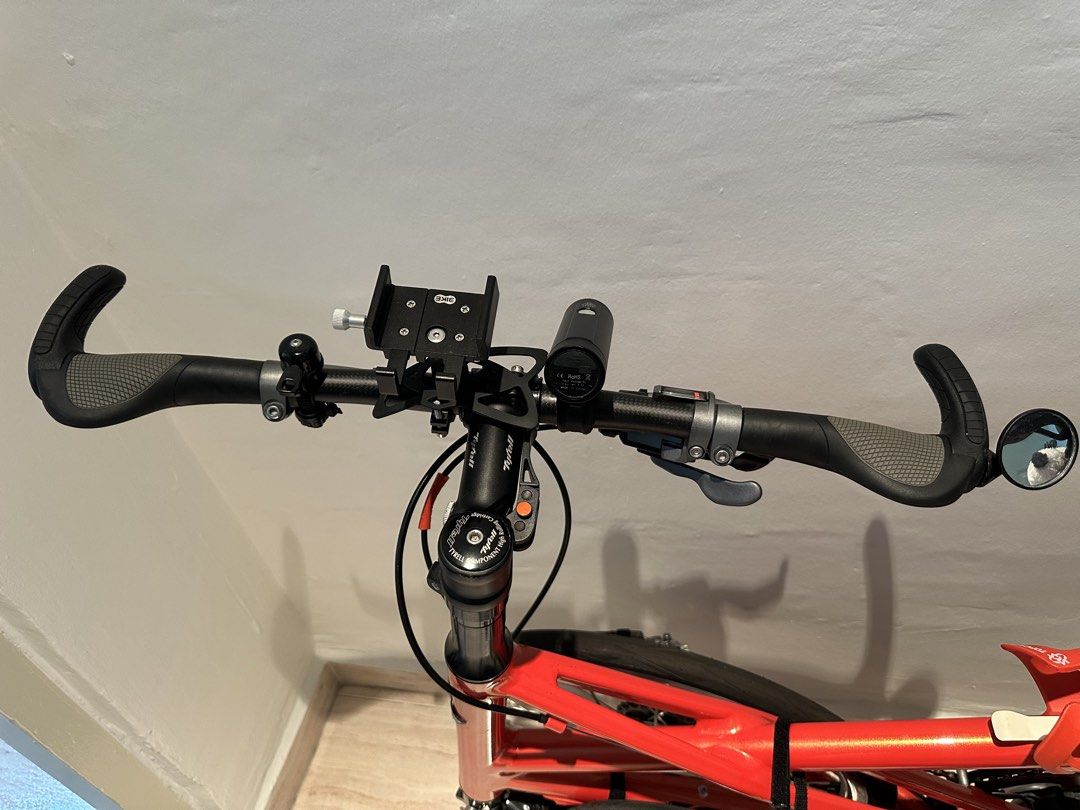 Tyrell FX (Category: Bicycles) located in Singapore. Submitted by v8craz (Listing ID 1463684191, Image 3). Description: A bright orange Tyrell FX folding bike impresses with - 20-inch wheels - a stylish aluminum X-frame - weighs about 7-8kg with its 10-speed Shimano Tiagra gears - special grips.